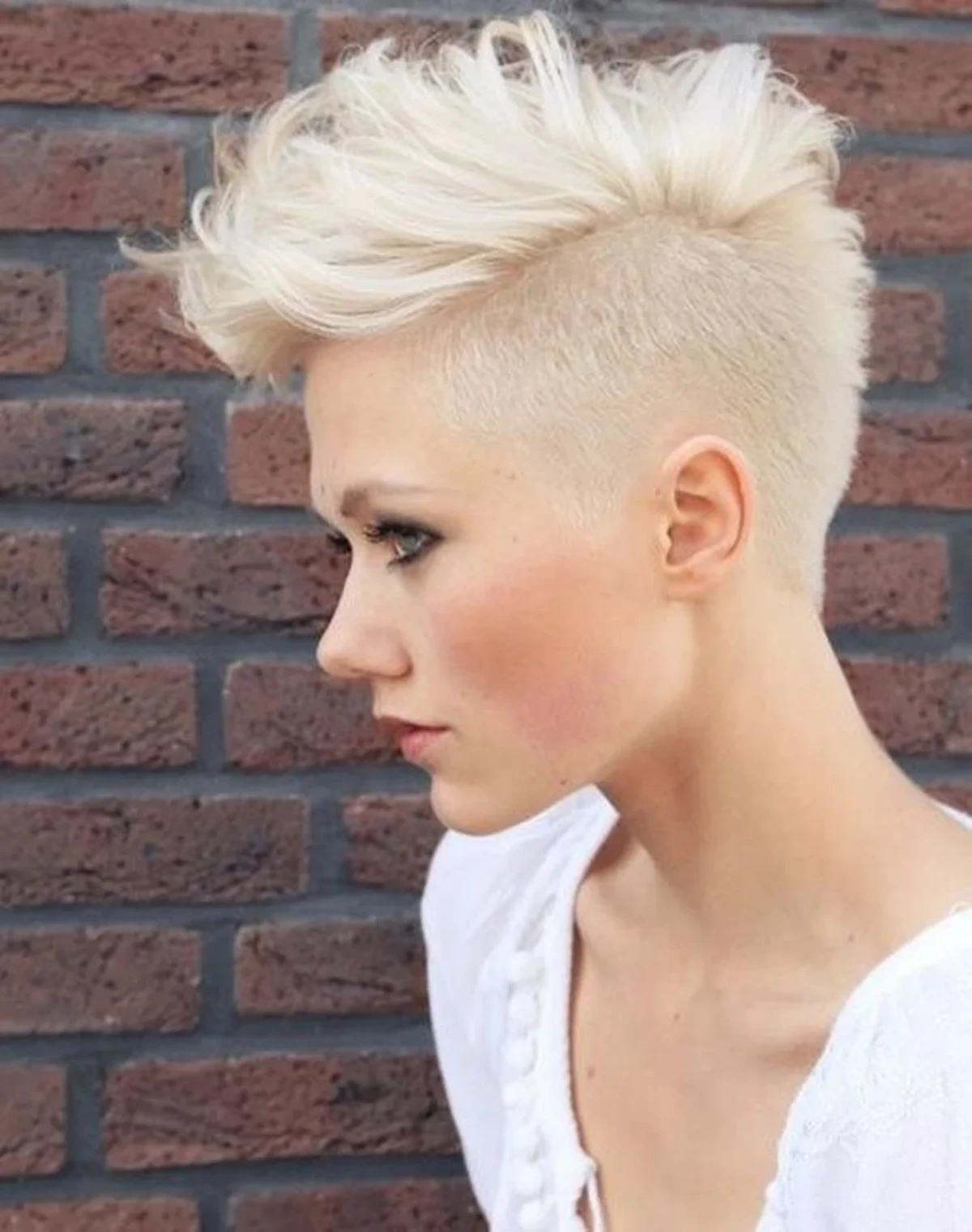 woman with white messy mohawk