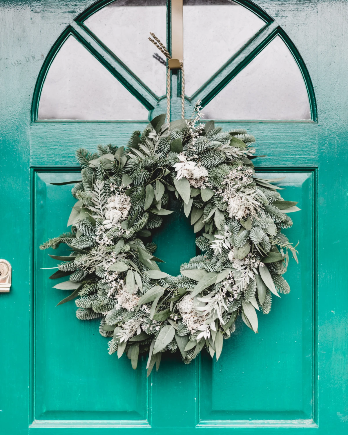 wreath with bright blue door