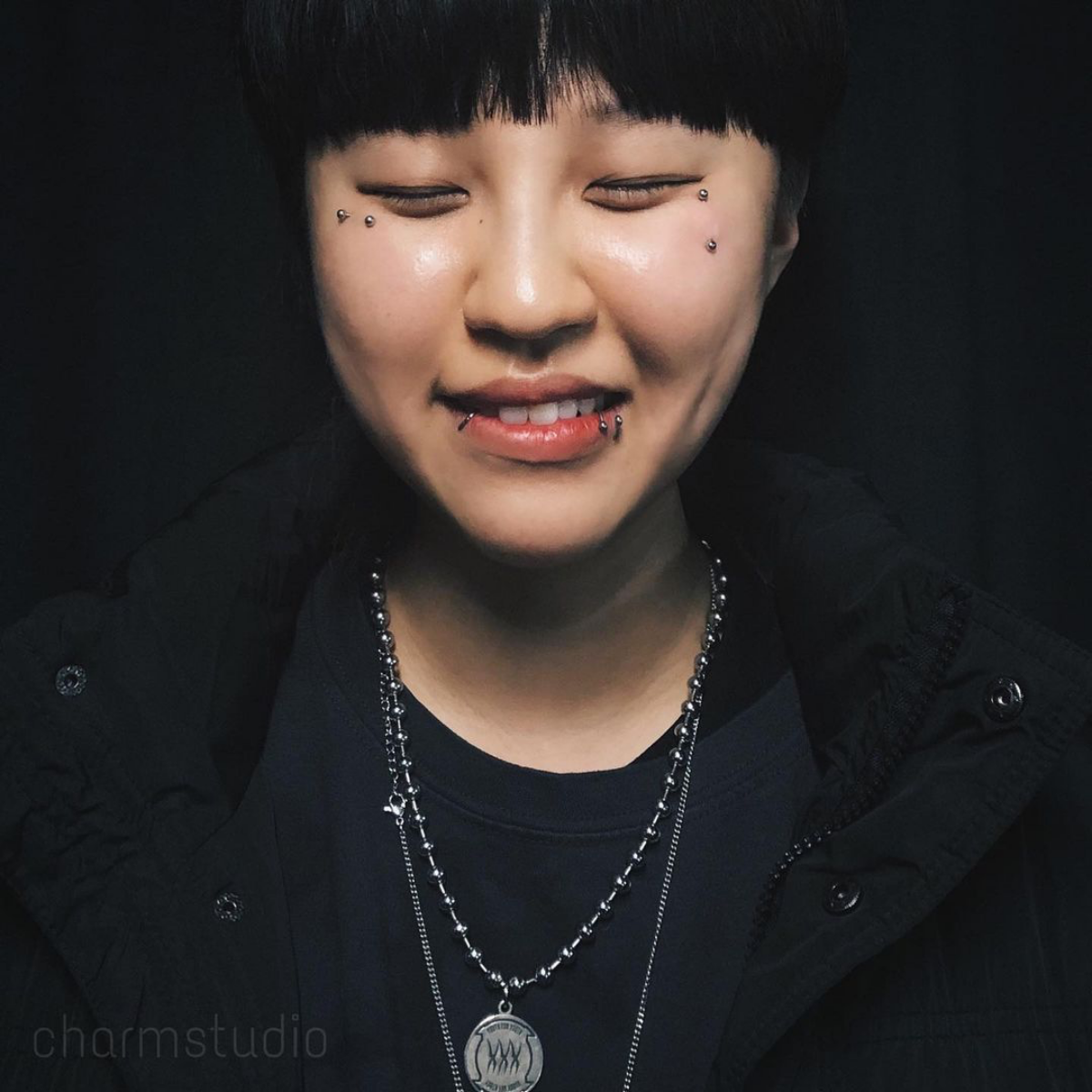 12 asian person with face piercings