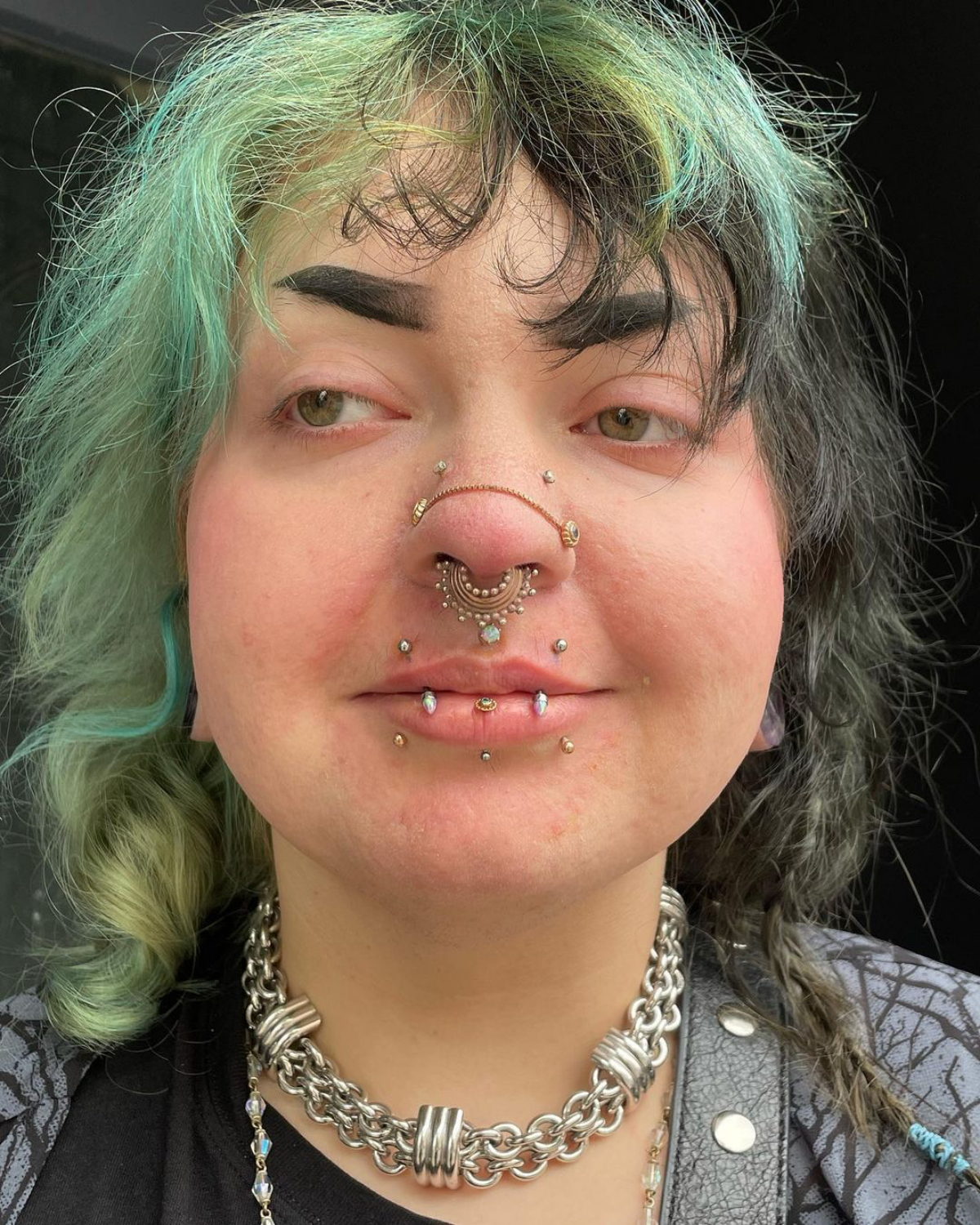 14 woman with chains nose piercing