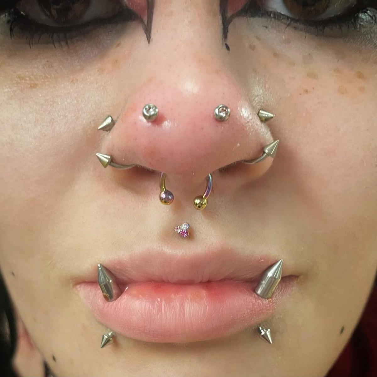 3 rhino piercing with two stones