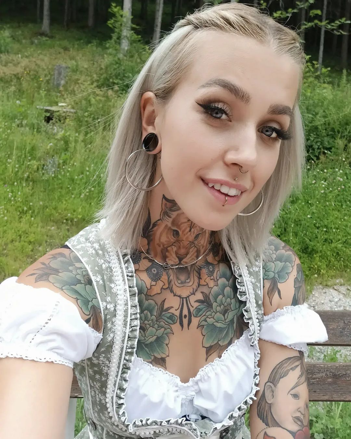 4 woman with face piercings and tattoos