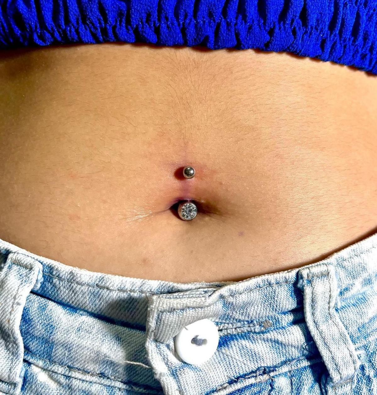 6 person with belly piercing