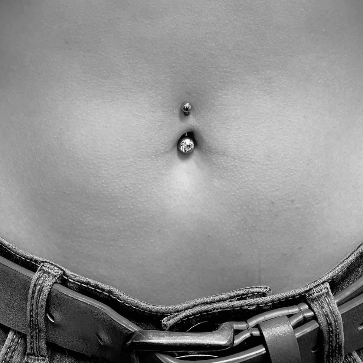 8 black and white belly button piercing