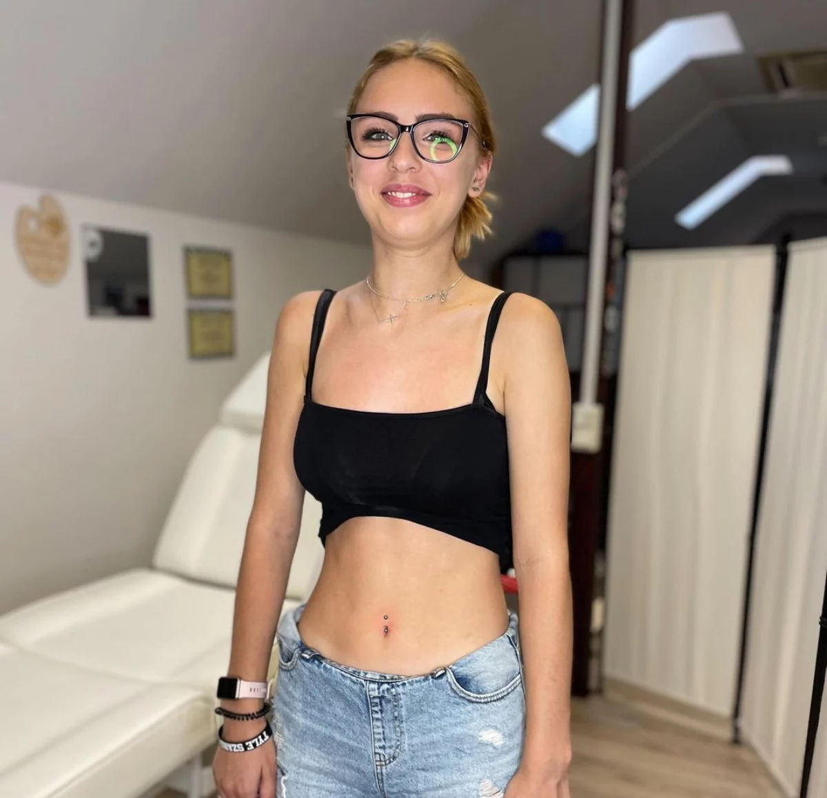9 woman with belly button piercing