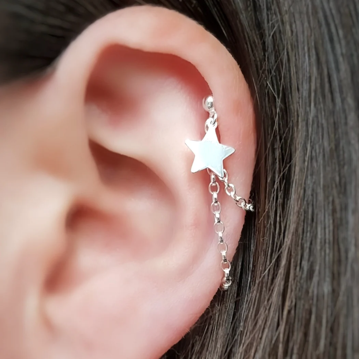 helix piercing dangling chain with star