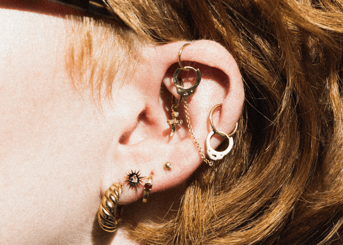 helix piercing woman with earrings
