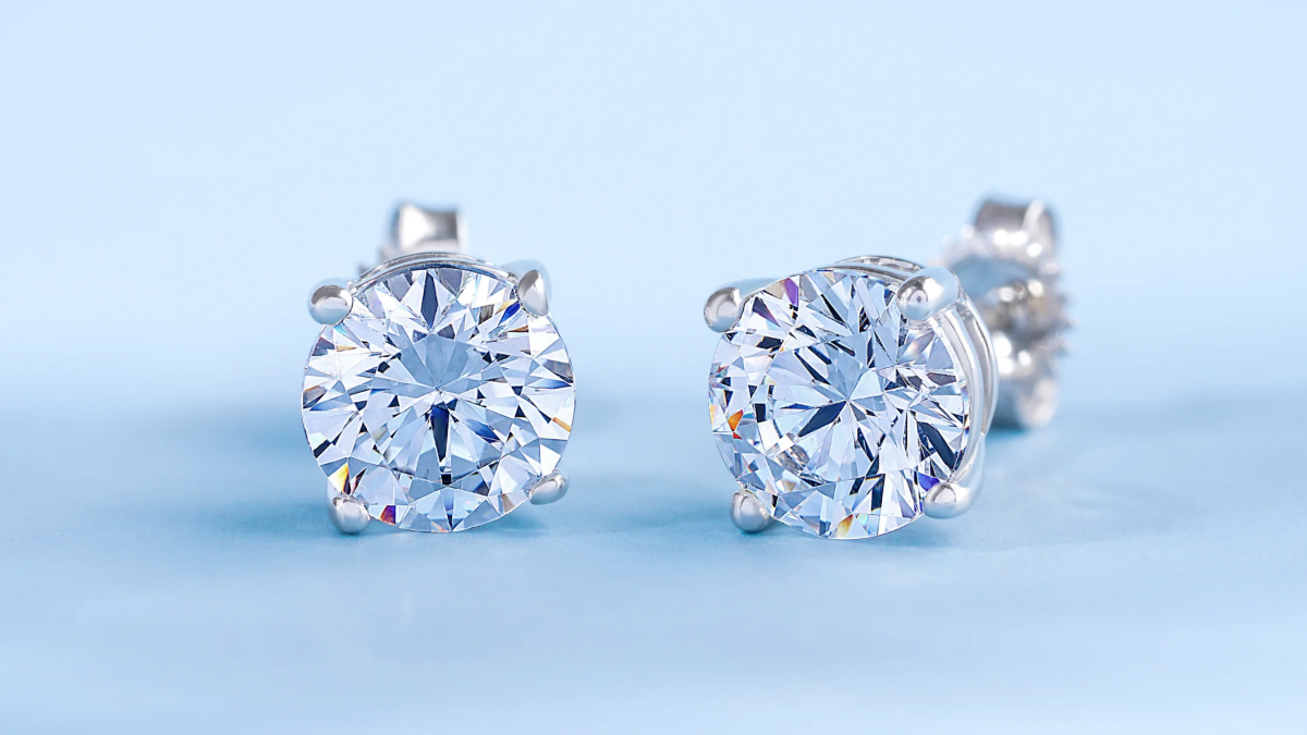 how to clean diamond earrings earrings on blue background