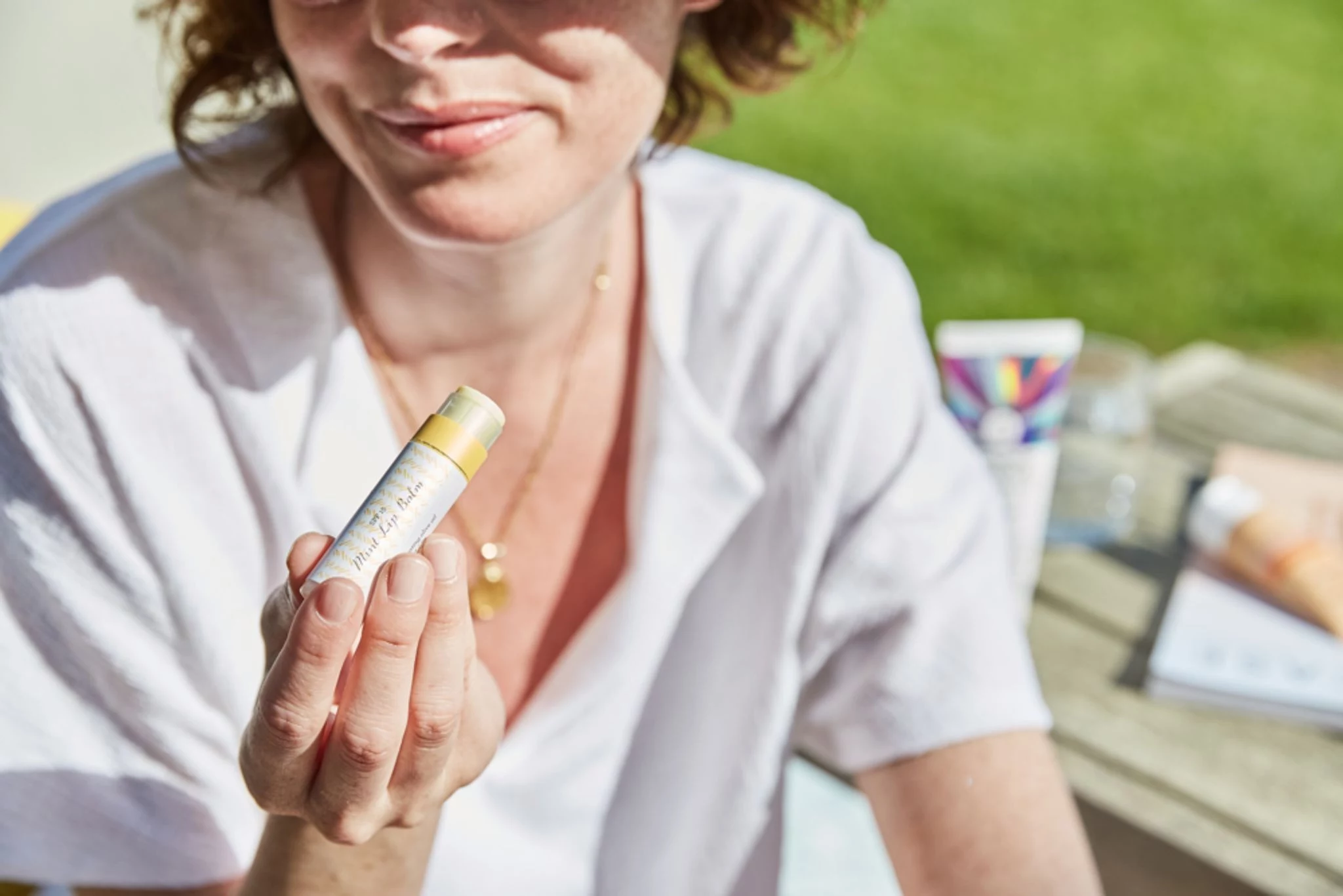 how to get chapstick out of clothes woman applying chapstick