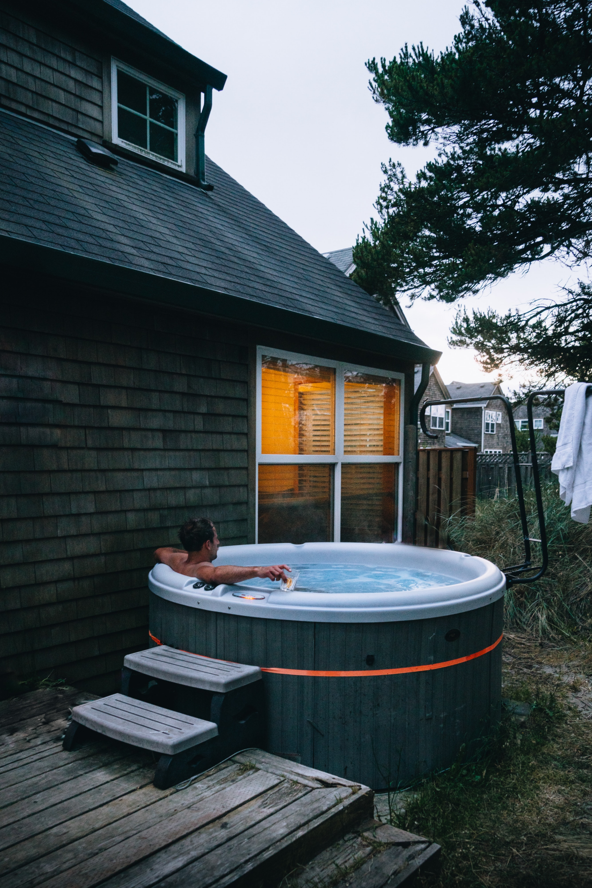 man lounging in outdoor hot tub