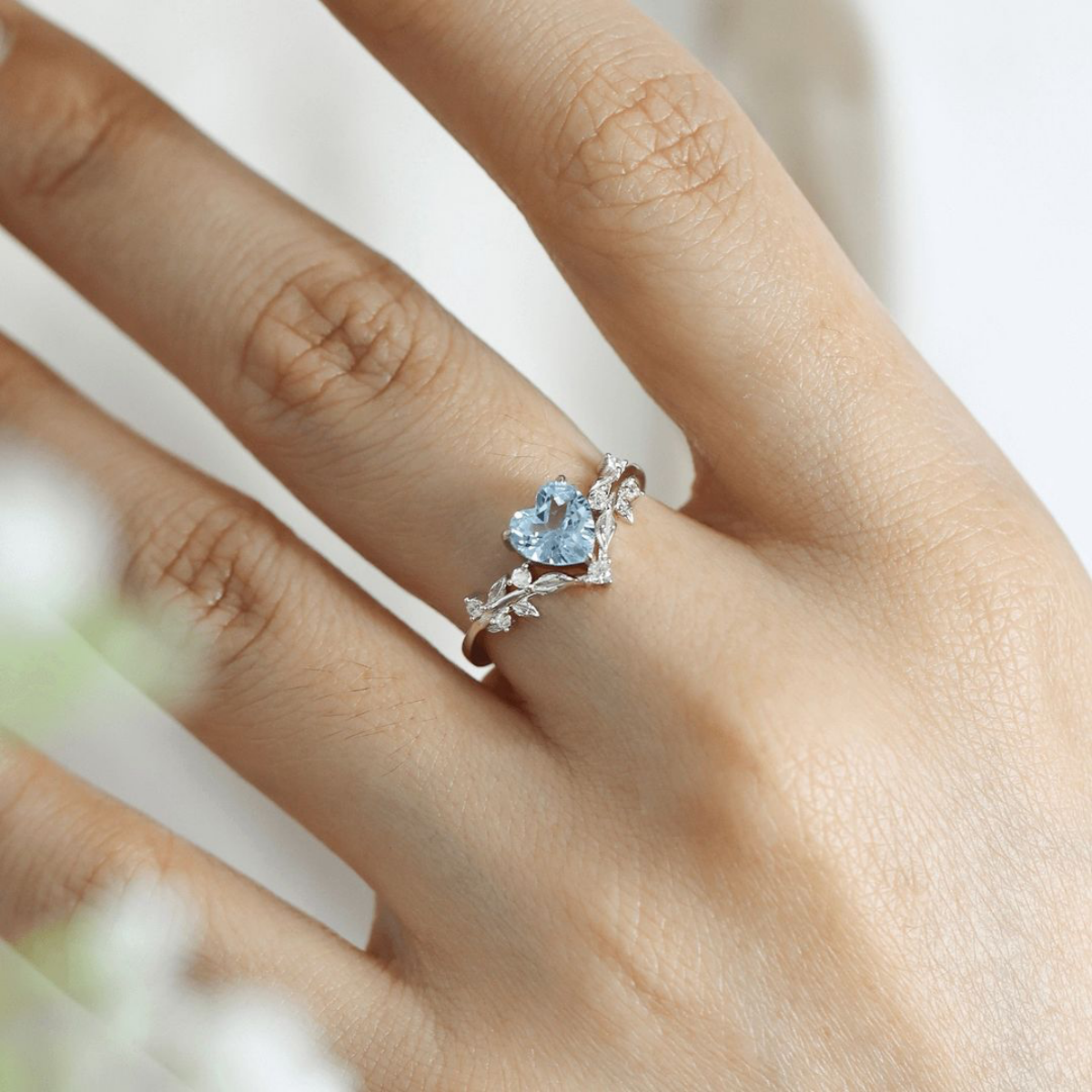 promise ring blue heart ring on hand
