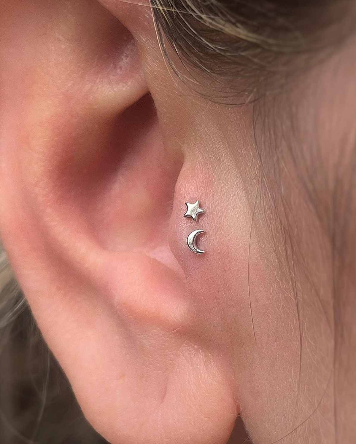 star and moon piercing ear