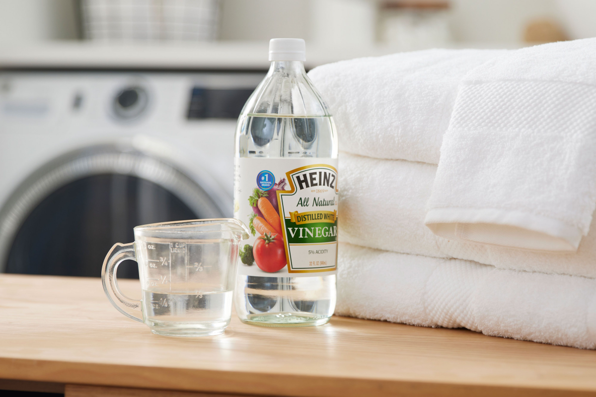 white vinegar next to white towels