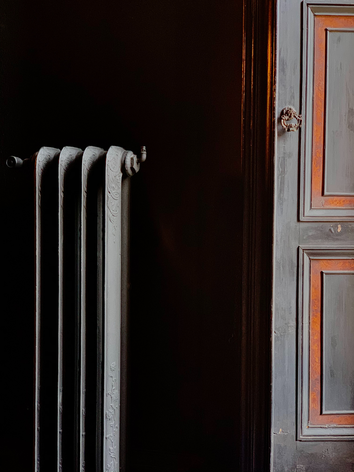 winterize your home black radiator near door