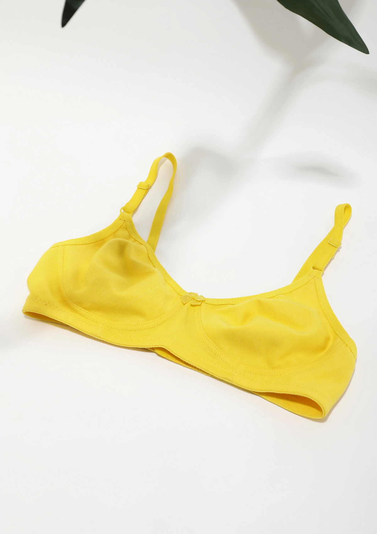 yellow bra on white background