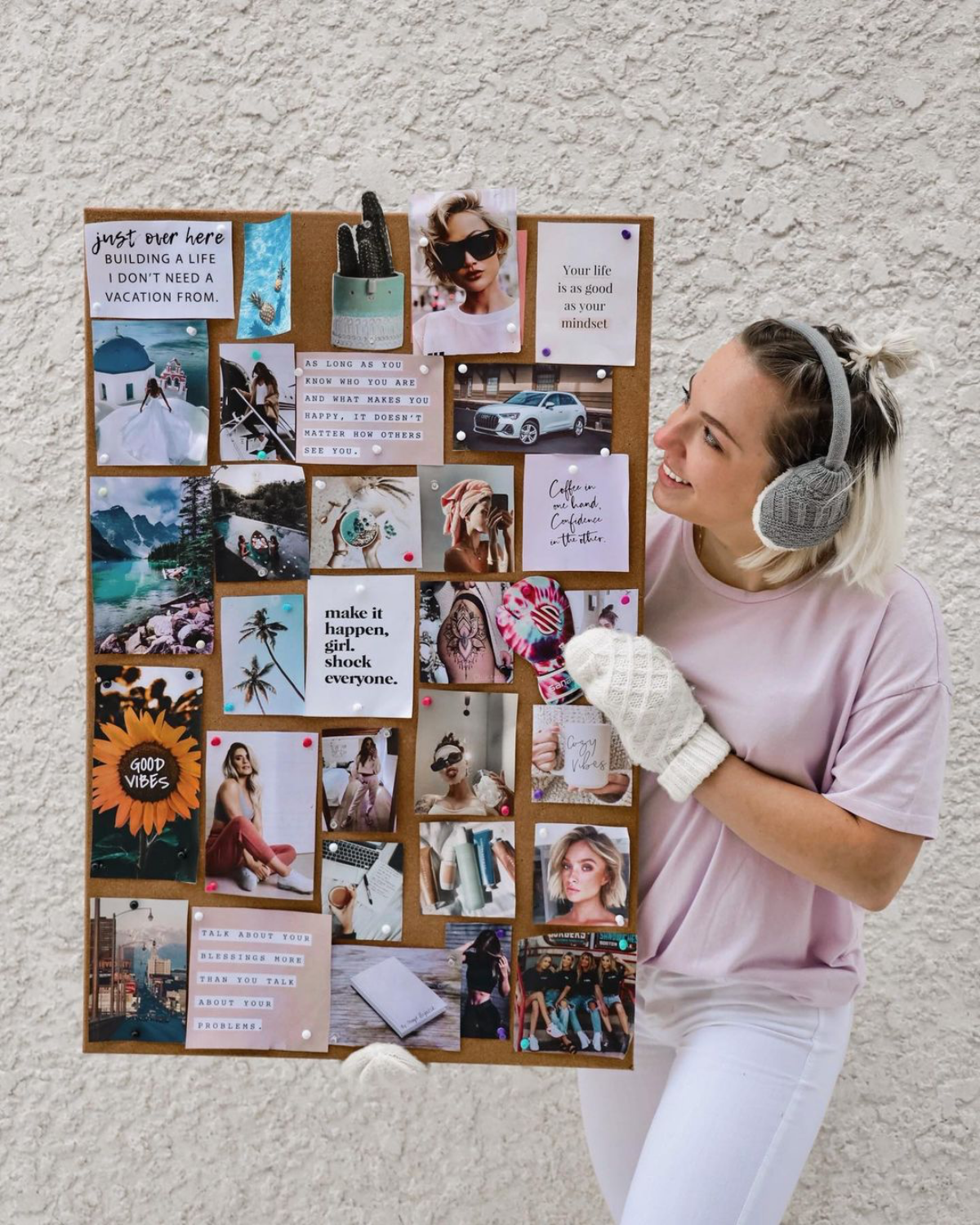 2024 vision board woman holding up board