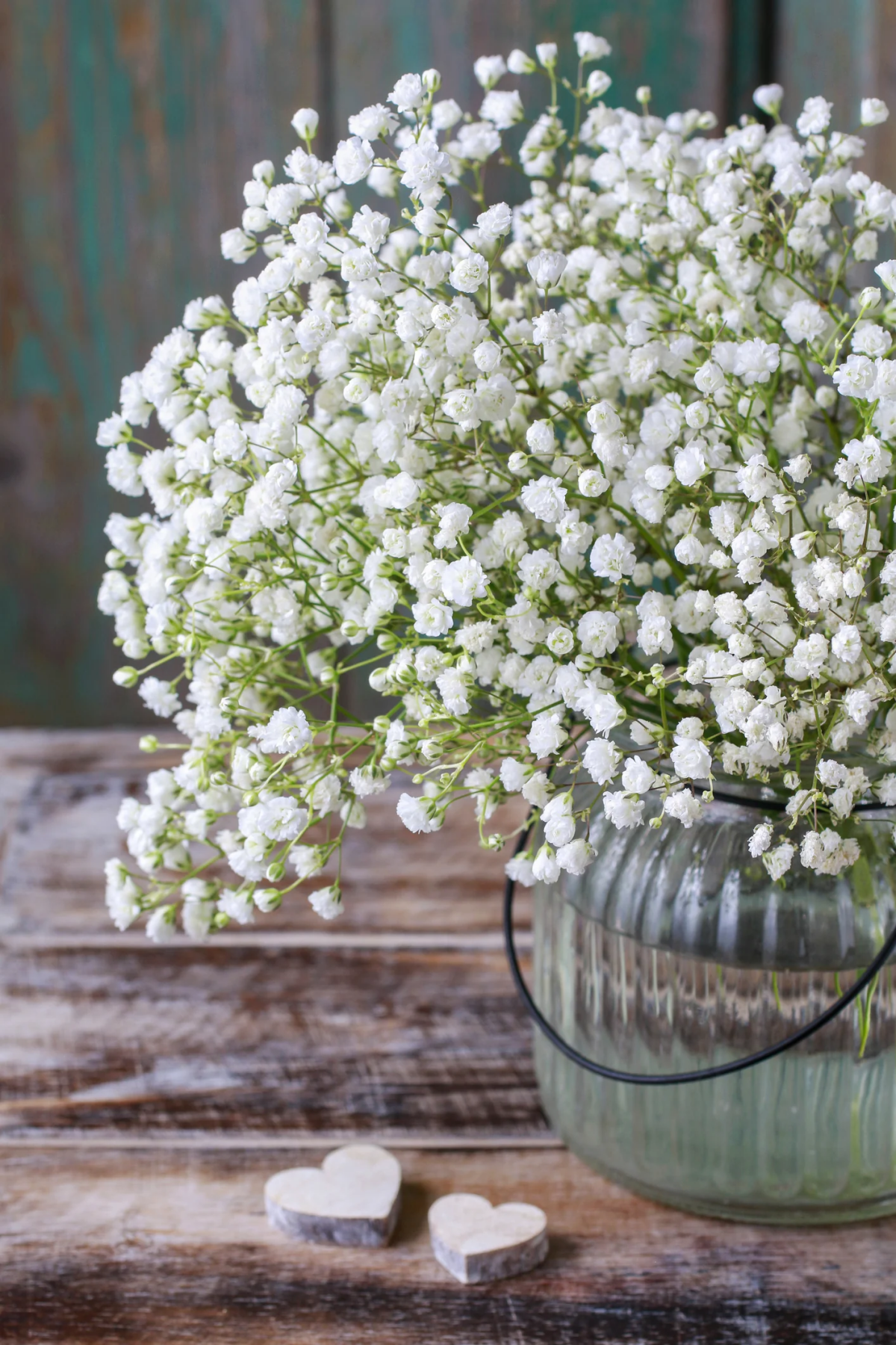 baby breath flowers in a blue vase