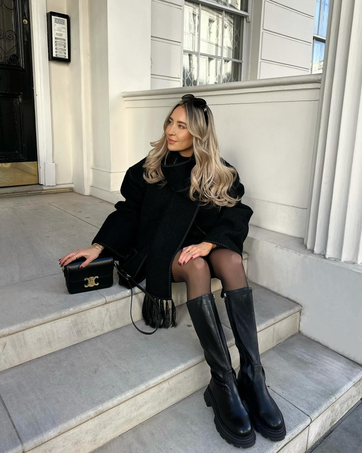 big black boots and black winter outfit