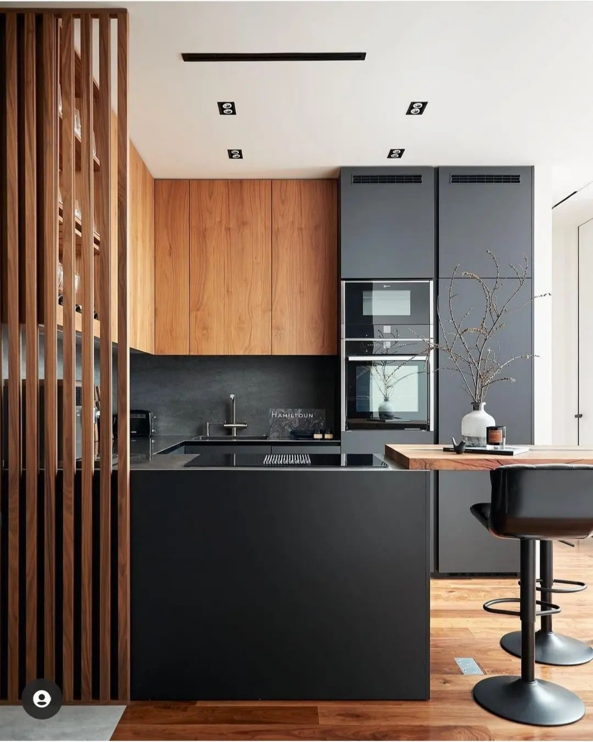 brown wood and black cabinets