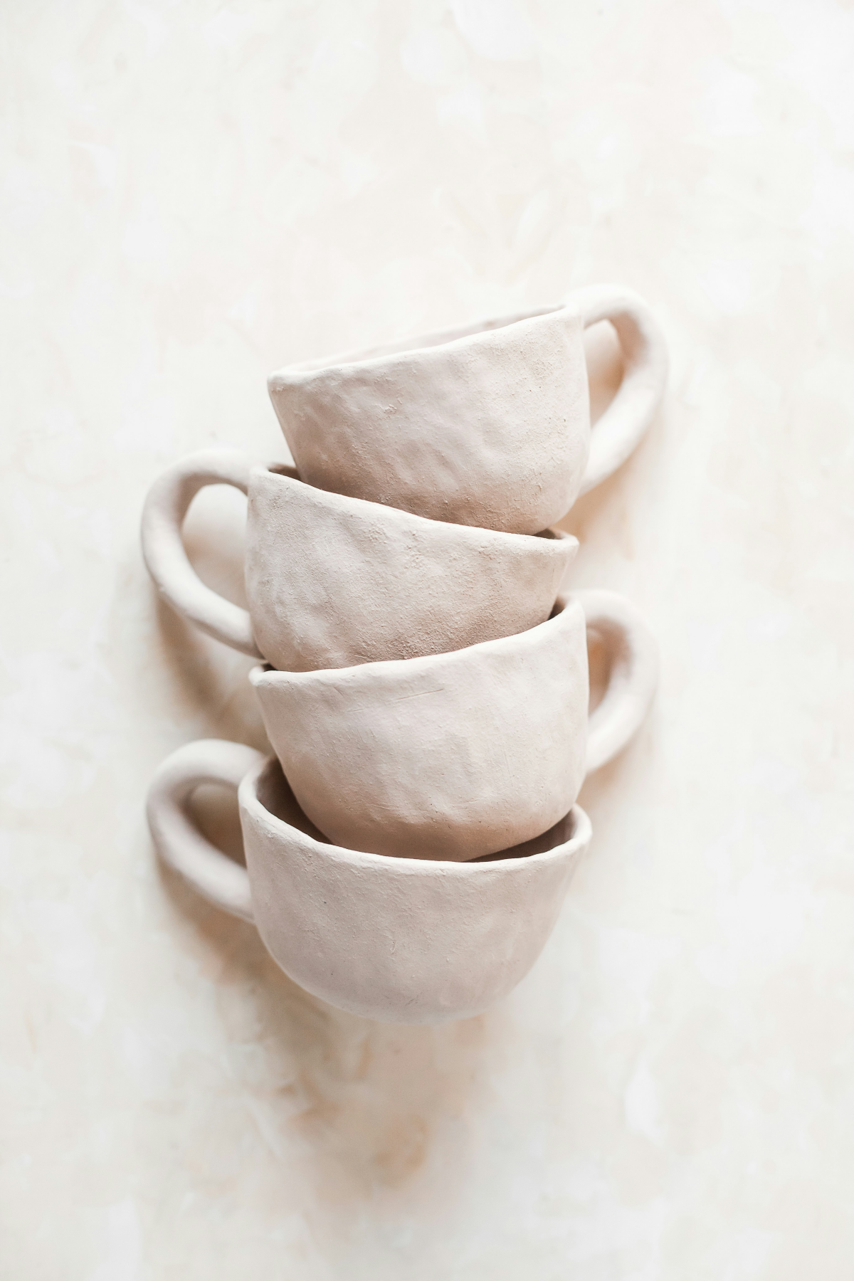 clay mugs in white