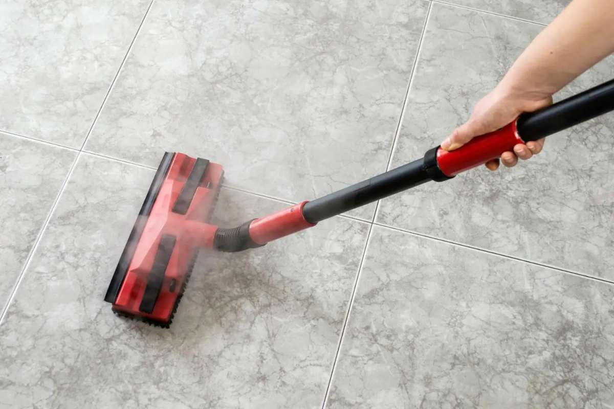 cleaning grout steam person steam cleaning grout
