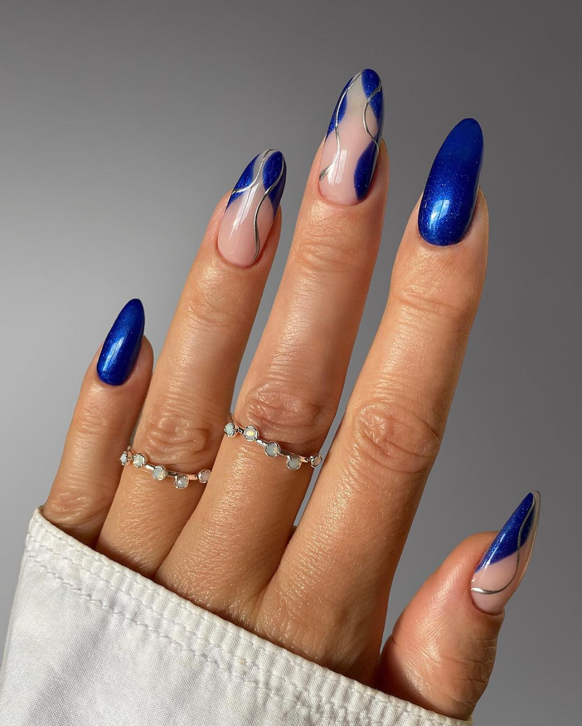 dark blue and silver accent nails