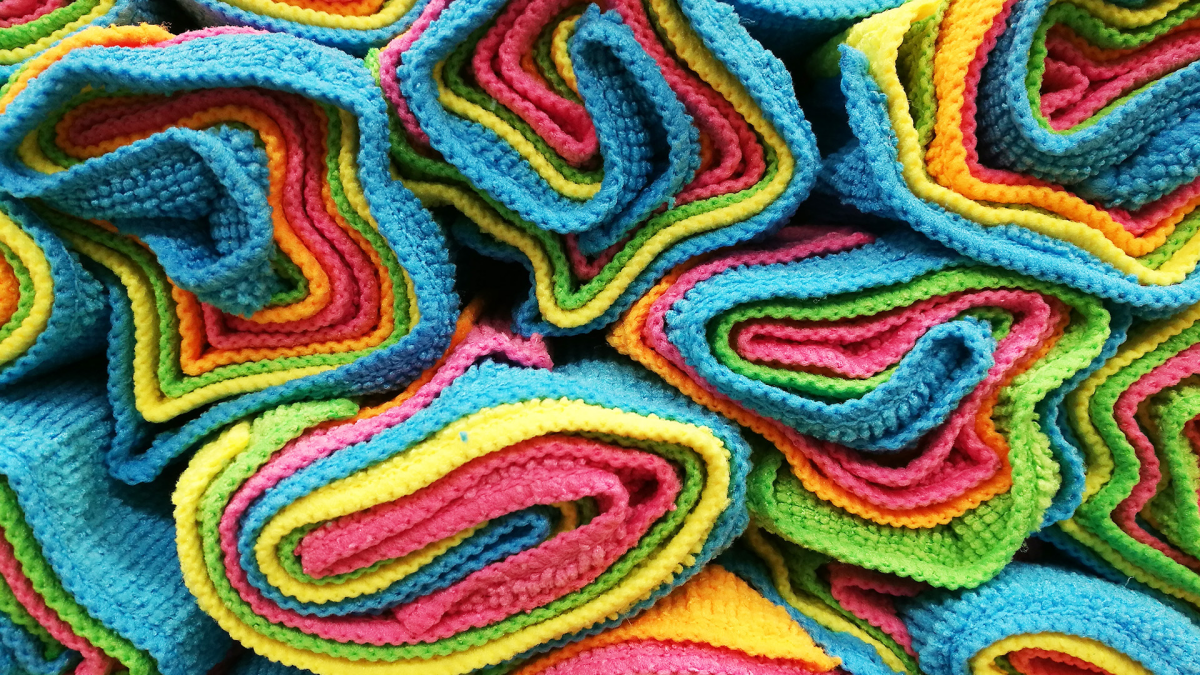 different colors of rolled up microfiber cloths
