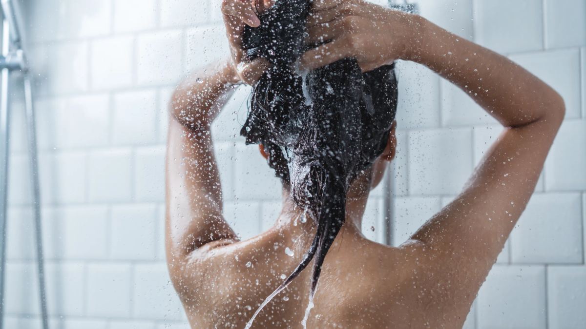 flaxseed mask woman washing her hair
