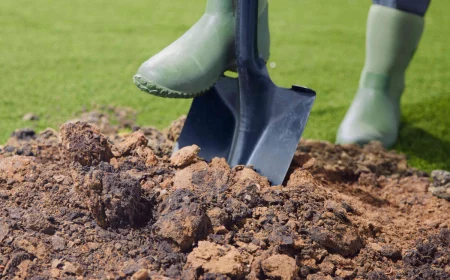 how to turn over soil person with shovel in soil