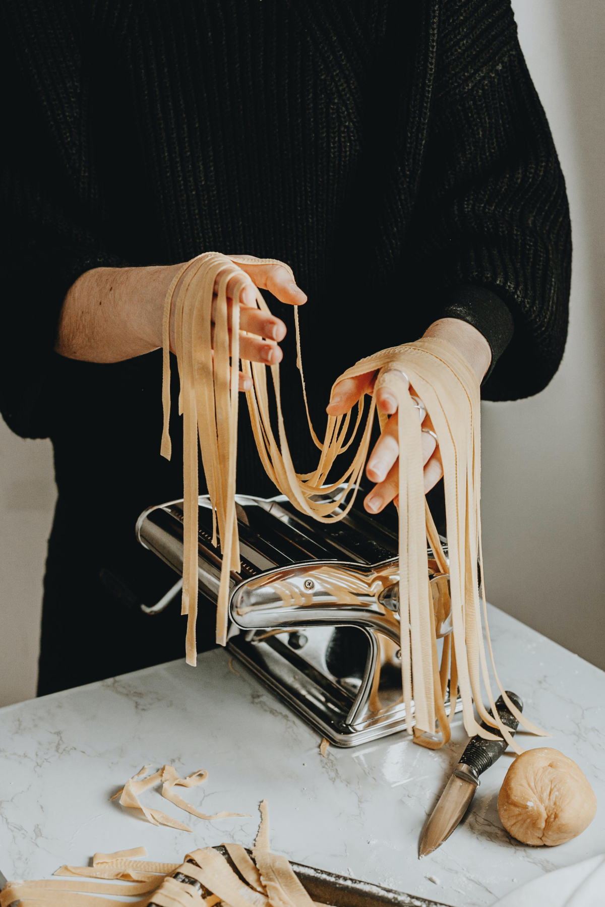 man making homemade pasta