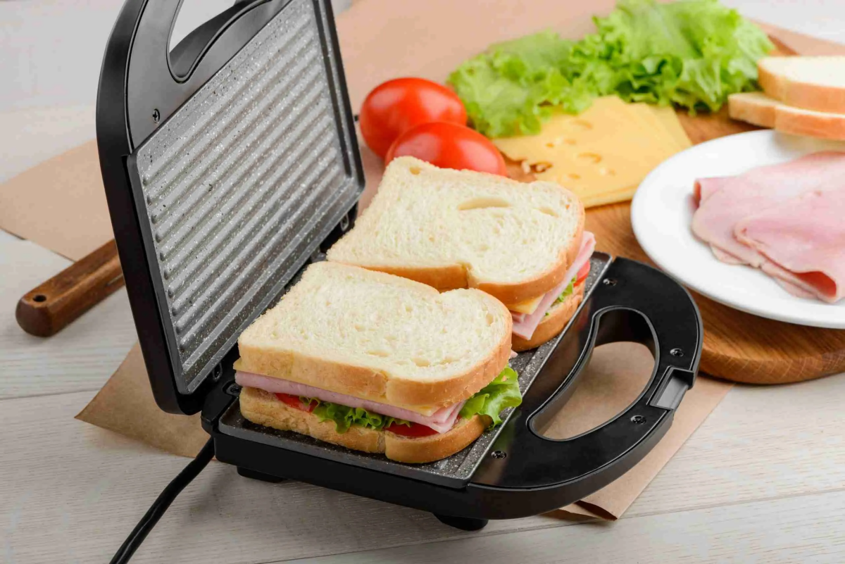 panini press with sandwiches on it