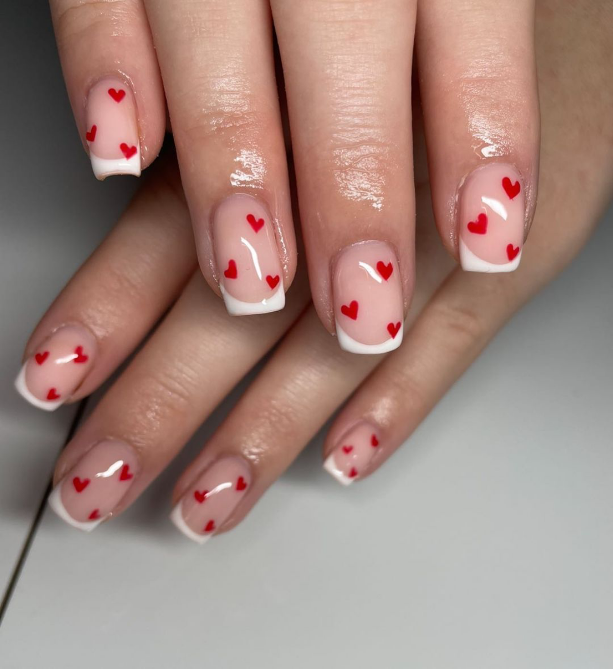 small red hearts on nails