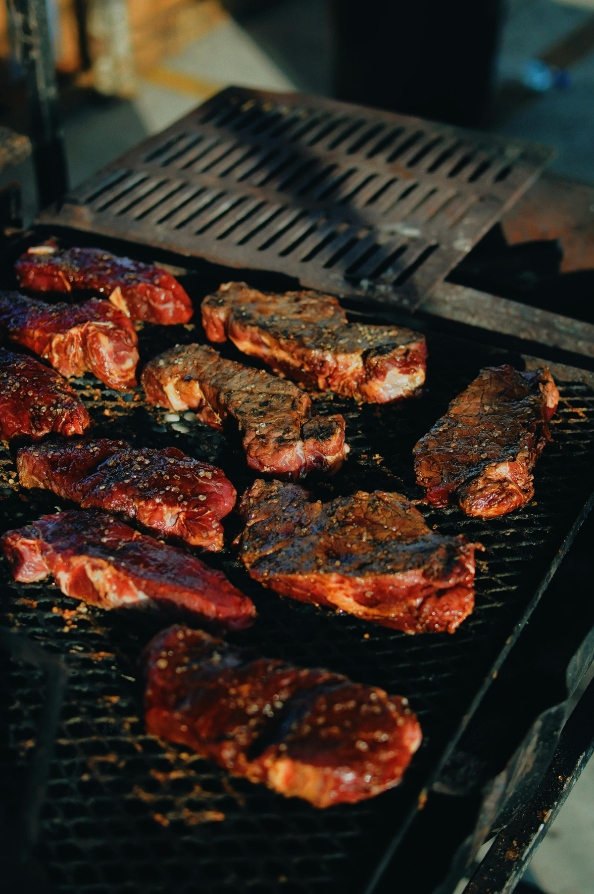 steaks on barbecue grill