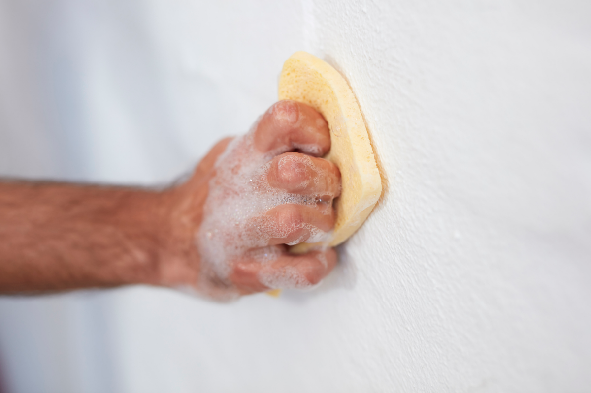wall cleaner scrubbing at walls