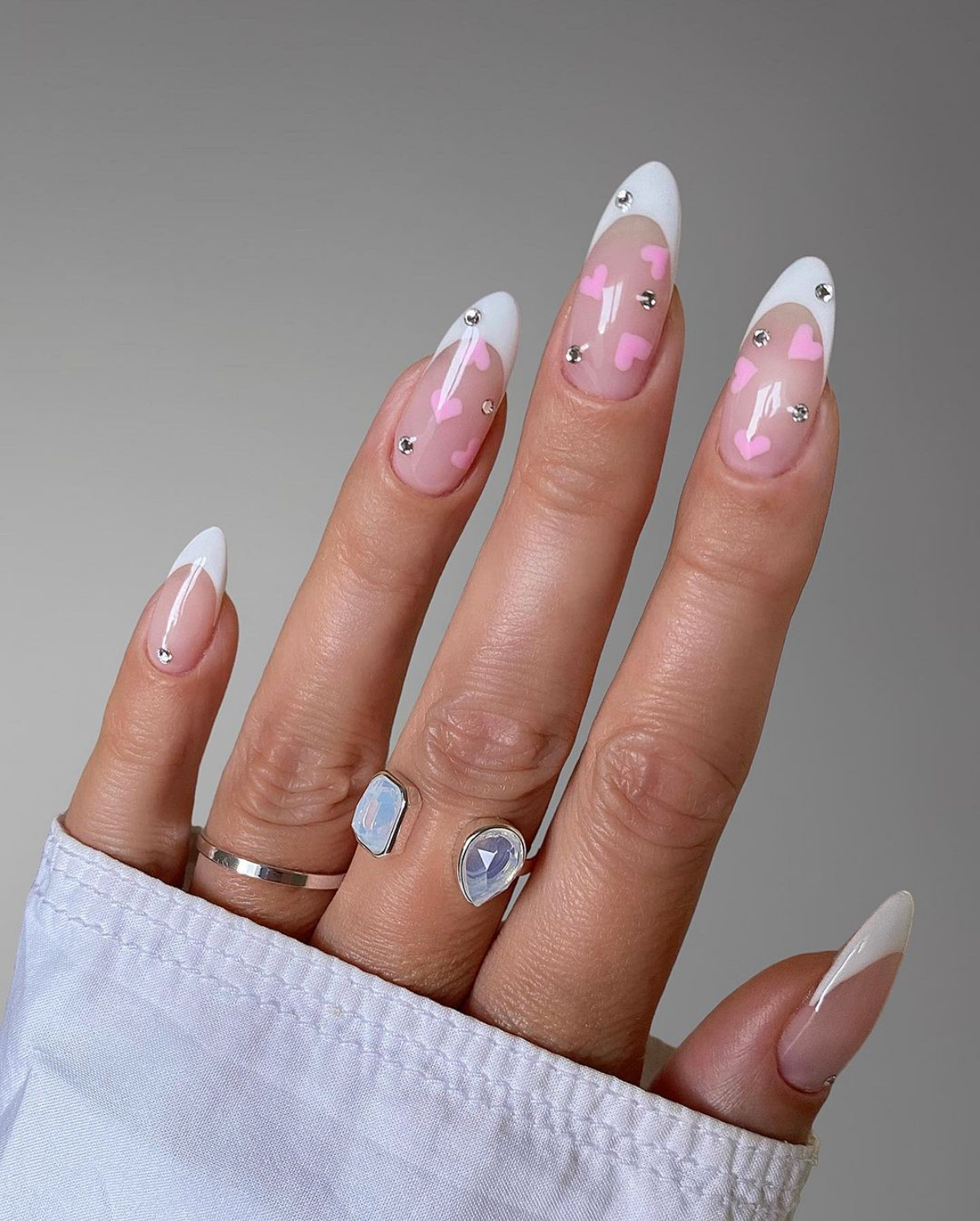 white french tip and small pink hearts