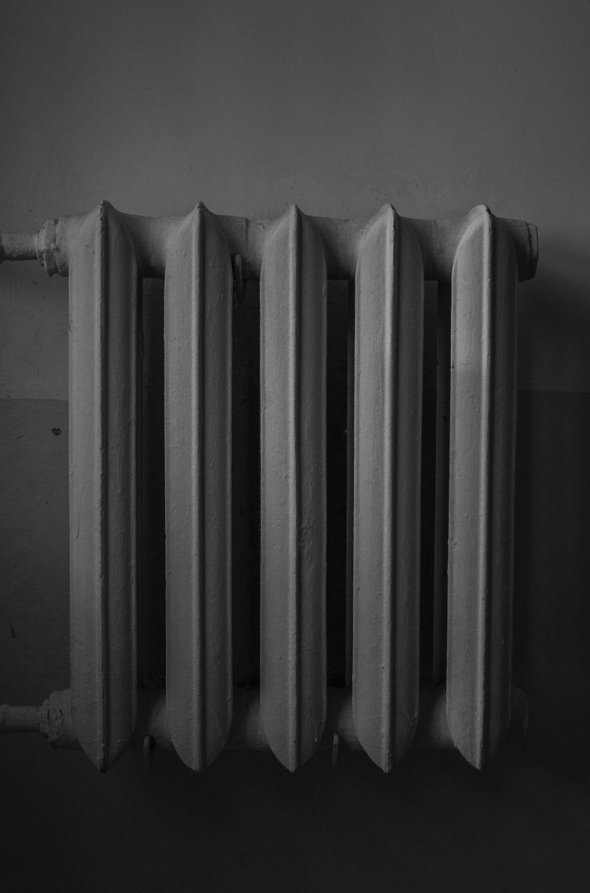 white radiator on wall