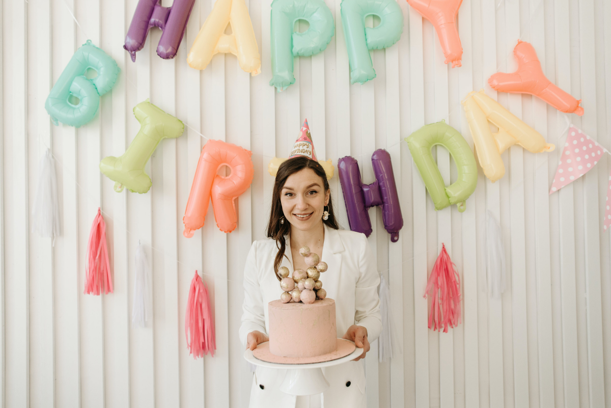 woman holding birthday cake