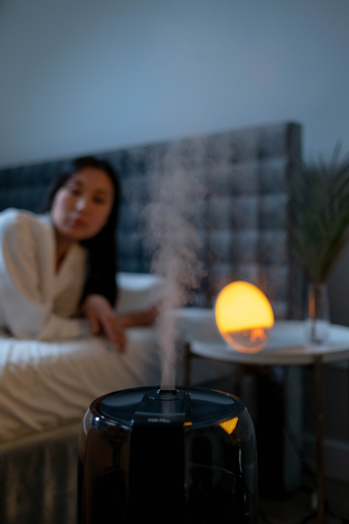 woman in bed with humidifier