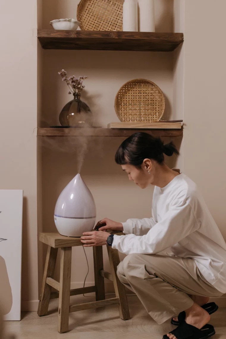 woman turning on humidifier