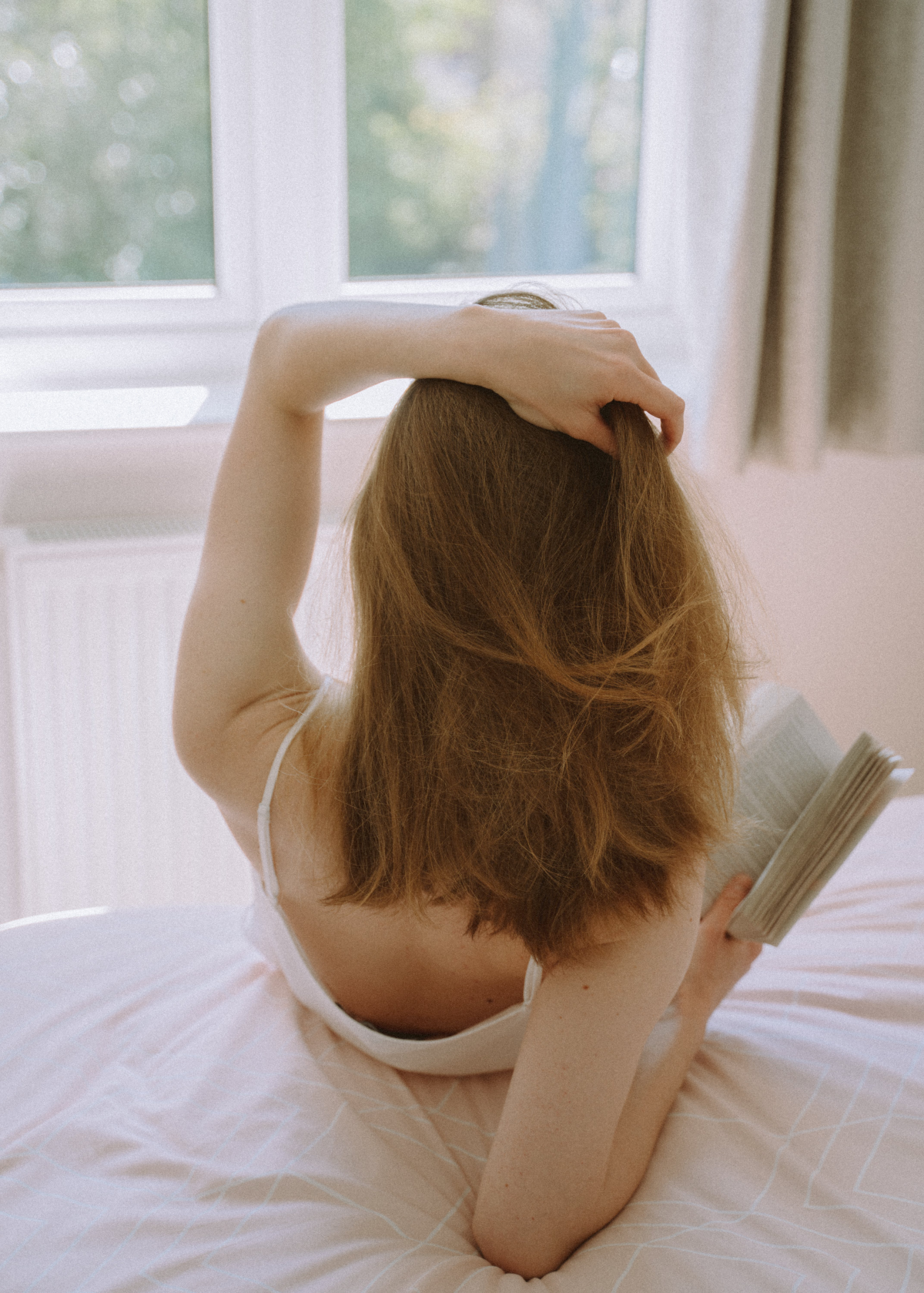 young adult books woman reading in bed
