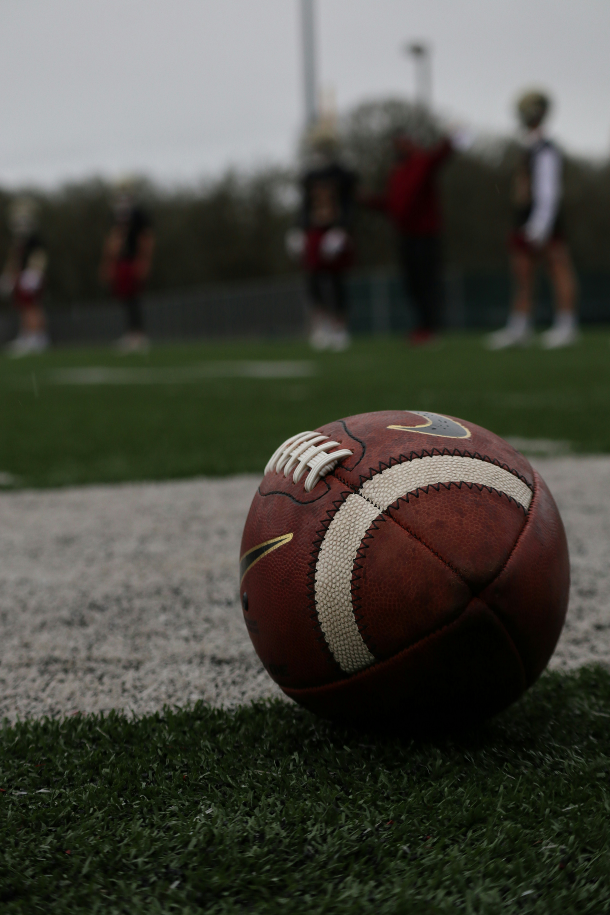 american football ball and field