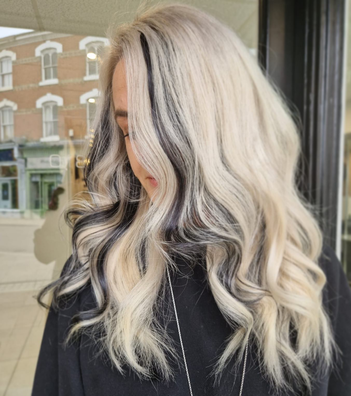 blonde hair with black accent streak