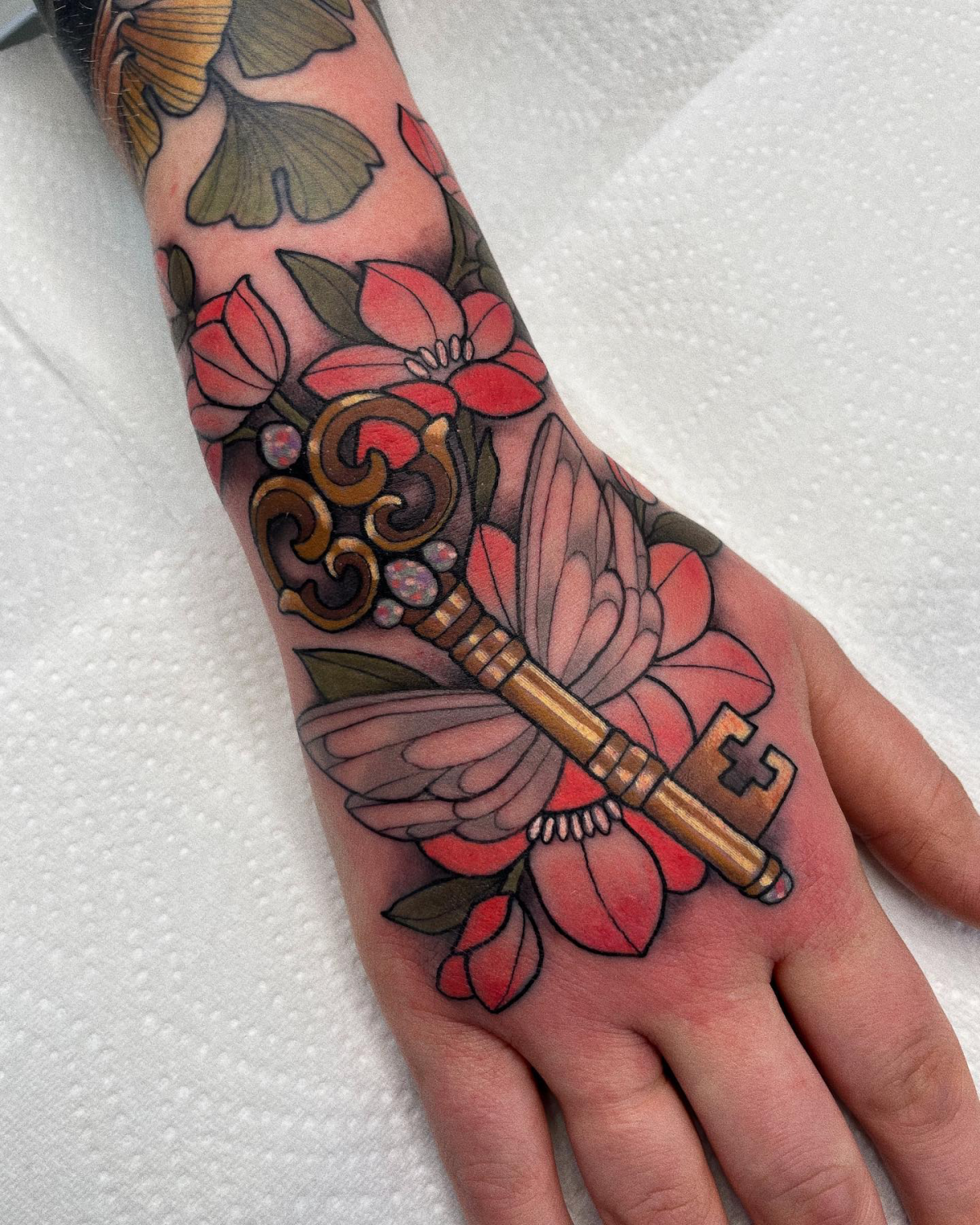 colorful flying key tattoo from harry potter