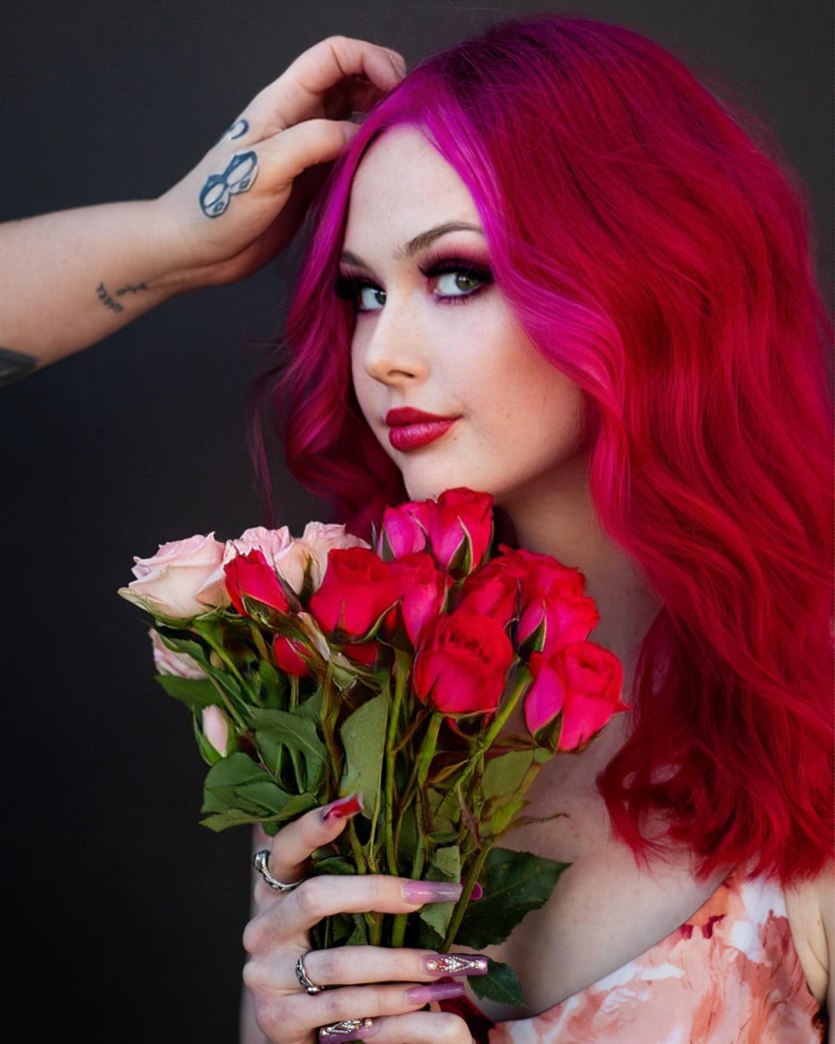 face framing pink hair and red hair