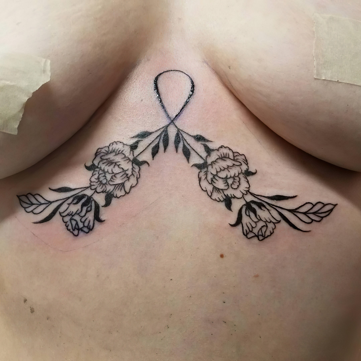 female small sternum tattoo