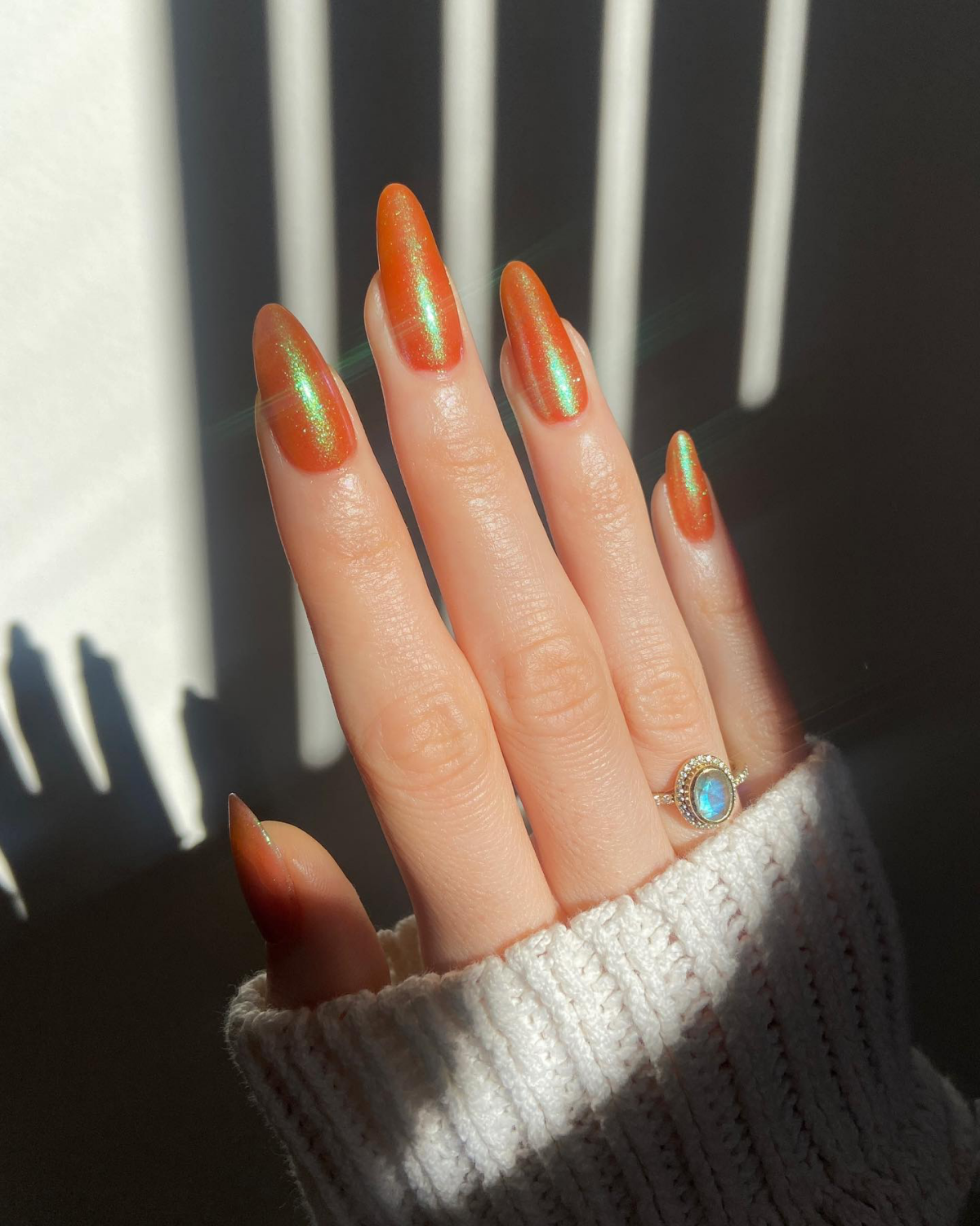 glitter on orange chrome nails