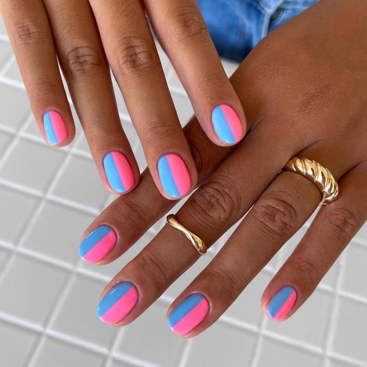 hot pink and blue nail design split in two