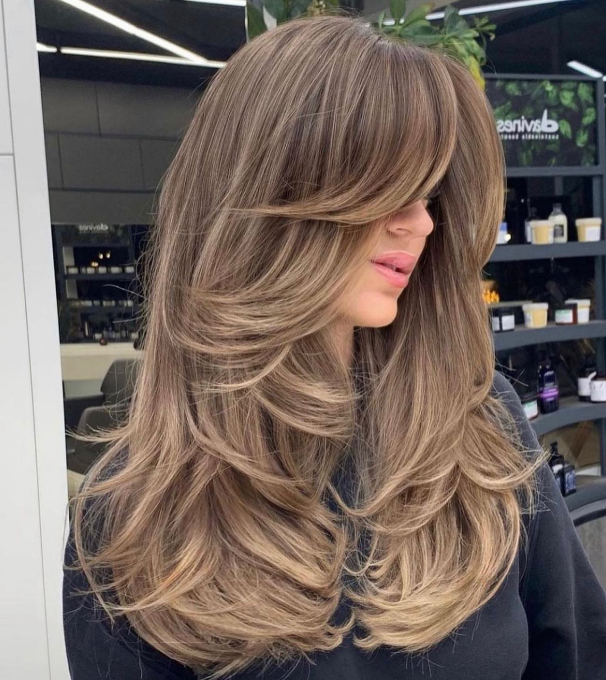 long curtain bangs on brown hair with highlights