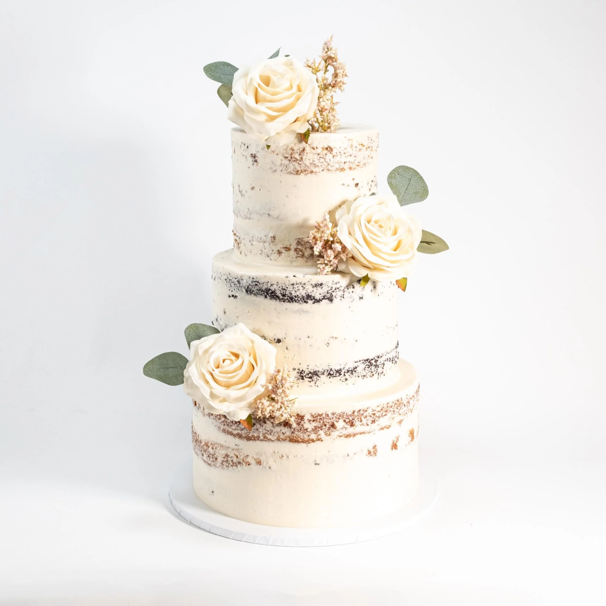 naked wedding cake flowers white
