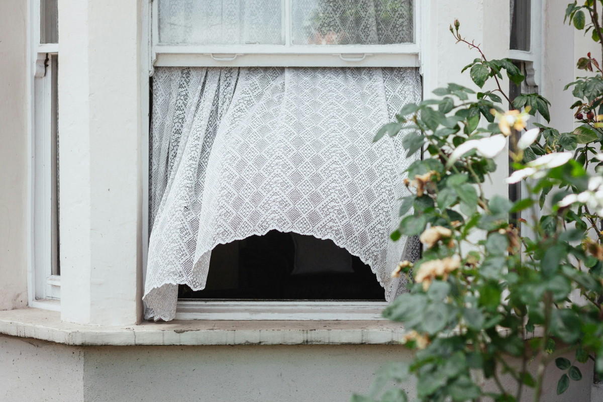open window with blowing curtain